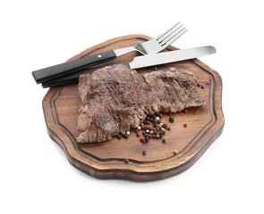 Fotobehang Piece of delicious grilled beef meat, peppercorns and cutlery isolated on white © New Africa