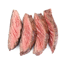 Schilderijen op glas Slices of tasty grilled beef meat isolated on white, top view © New Africa
