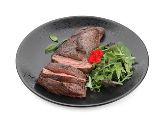 Fotobehang Pieces of delicious grilled beef meat and greens isolated on white © New Africa
