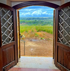 open door overlooking the countryside in Sicily, Italy