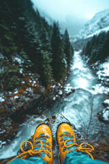 Close-up of a hiker's hiking boots, bright yellow, on the waters of a mountain stream.Adventure,exploration and overcoming challenges.