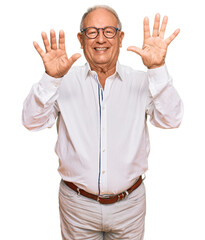 Senior caucasian man wearing business shirt and glasses showing and pointing up with fingers number ten while smiling confident and happy.