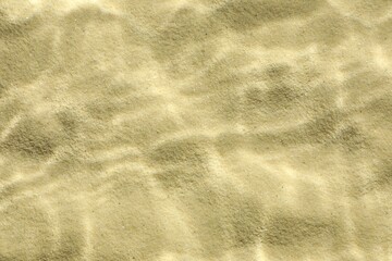 Sand under water as background, top view