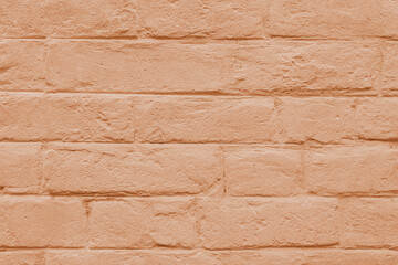 Obraz premium Abstract weathered masonry, aged texture. Stained old stucco orange painted brick wall background, grungy rusty blocks of brickwork close up. Wallpaper, backdrop