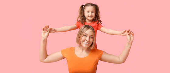 Mother and daughter smiling on pink background. Mother's Day