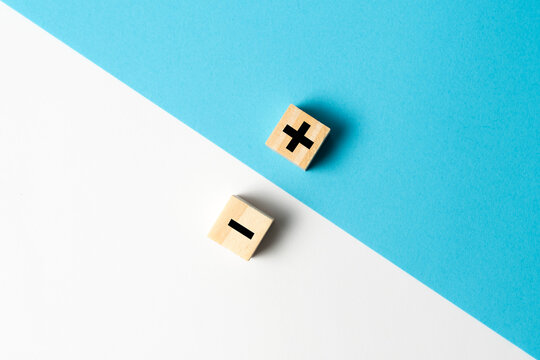 The concept of opposites or pros and cons using plus and minus signs