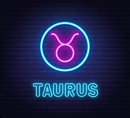 Neon Taurus Sign on brick wall background.