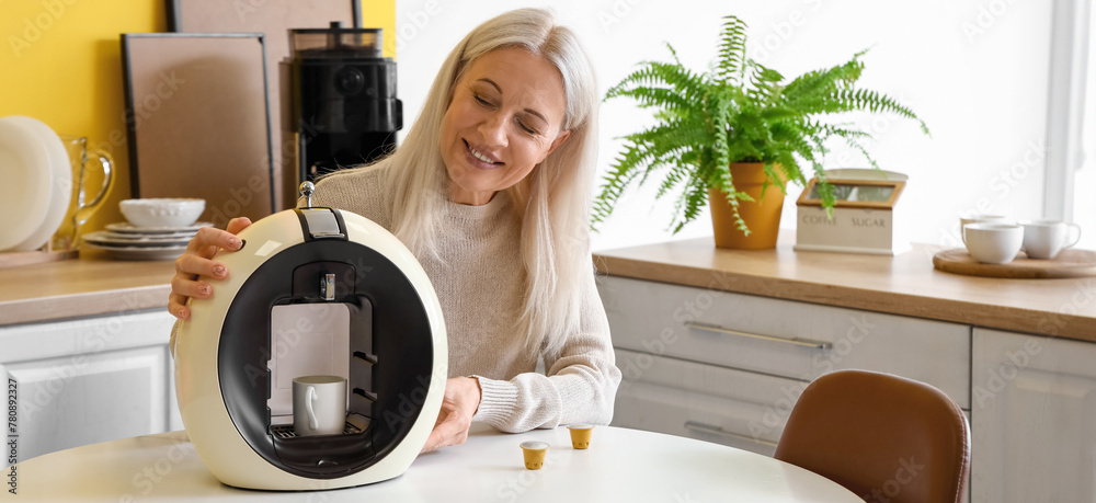 Sticker mature woman with modern coffee machine in kitchen