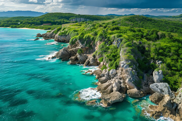 Aerial view of rocky coastline with lush greenery and turquoise sea