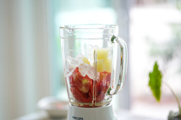 healthy eating, cooking, vegetarian food, close up of  fruit juice blender at home