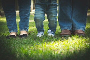 Family members shoes feet together in a park in Lima Peru - obrazy, fototapety, plakaty