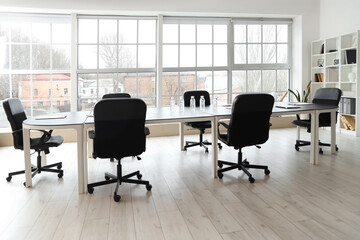 Table with water bottles in office prepared for meeting