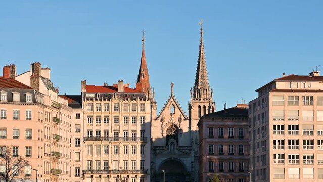 Lyon, France, December 27, 2023. Zoom and tilt footage on the facade of the Saint-Nizier church. POV on the opposite bank of the Saone River.