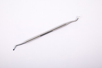 Dental instrument on a white background. Health and hygiene - 780914301