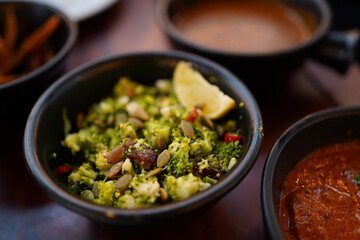 a bowl of chili broccoli salad 