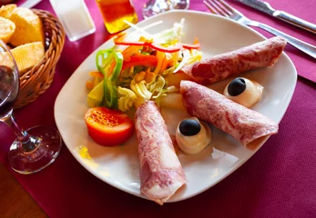  Tasty asparagus rolled with ham and vegetables salad on plate © JackF