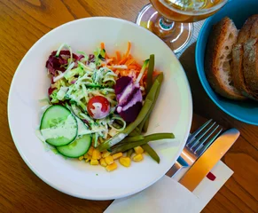  Deliciously salad of corn, cucumbers, cabbage and boiled bean with carrot © JackF