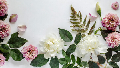 flat lay flower layout on white background; top view negative space.png