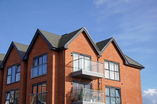 Residential block of flats. Small housing development. Apartment building exterior 