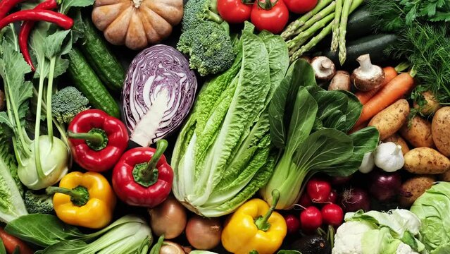 Vegetables set. Vegetables backdrop. Variety of fresh vegetables, food background, top view, stock footage video 4k