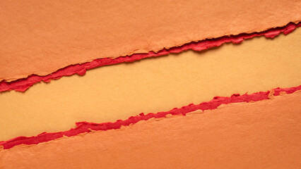 paper abstract in orange and red with a copy space - sheets of handmade paper, diagonal blank web banner, warning, alert and danger concept