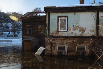 Flooded old house. Flooded old window. Natural disaster concept