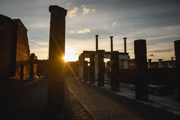 Columns of the ancient Roman city of Pompeii in Italy, sunset time.