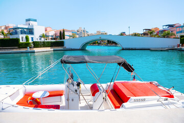 Moored boat with arch bridge at background. Luxurious harbor in Limassol Cyprus