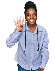 Young african american woman wearing casual clothes showing and pointing up with fingers number four while smiling confident and happy.