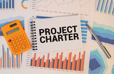 Project Charter text on blackboard, business concept background