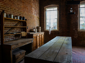 Wooden Table and Vintage Food Containers in The Kitchen at Fort Clinch, Fort Clinch State Park, Amelia Island, Florida, USA