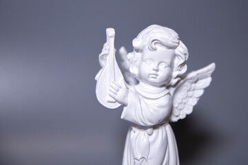 Angel statues isolated on white background.