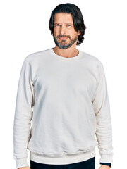 Middle age caucasian man wearing casual clothes skeptic and nervous, frowning upset because of problem. negative person.