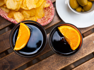Red vermouth drink with slice of orange, popular spanish aperitif served with tapas