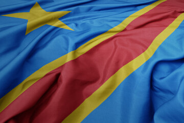 waving colorful national flag of democratic republic of the congo.