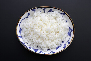 Cooked rice in white bowl