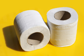 Toilet paper on yellow background.