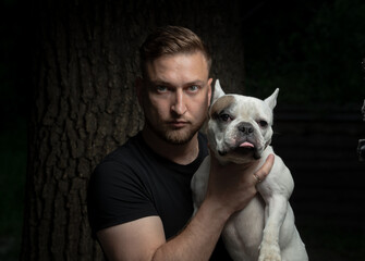 portrait of a man with a French bulldog - 780968151