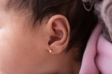 Close up macro photography of a newborn baby ear person attention listen - obrazy, fototapety, plakaty