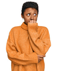 Young african american woman wearing casual clothes looking stressed and nervous with hands on...