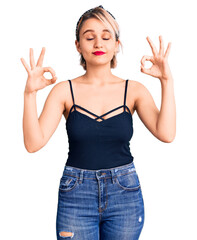 Young beautiful blonde woman wearing casual clothes relax and smiling with eyes closed doing meditation gesture with fingers. yoga concept.