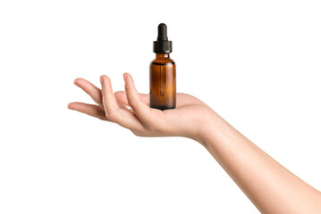Woman hand holding cosmetic  serum bottle for skin care on white background. 
