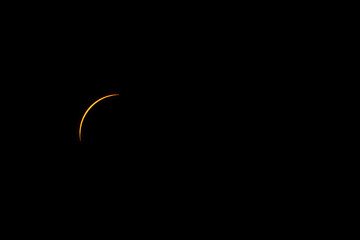 The solar eclipse on April 8, 2024 before totality. Only a tiny sliver of the sun is visible.