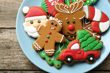 Different tasty Christmas cookies on wooden table, top view. Space for text