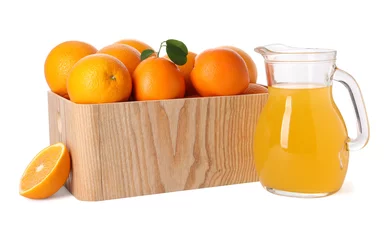  Fresh oranges in wooden crate and juice isolated on white © New Africa