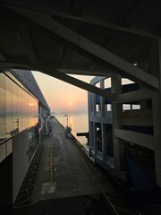 Fototapeta premium sunset through the building screen 