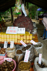 A small Chinese food store offers local agriculture in Zhangjiajie National Forest Park in China.