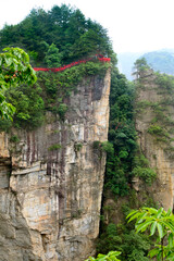 Red blessing ribbons line a mountaintop trail in Zhangjiajie National Forest Park in Wulingyuan Scenic Area, China.