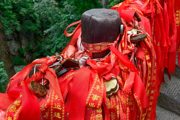 Red blessing ribbons and love locks line handrails in Zhangjiajie National Forest Park in Wulingyuan Scenic Area, China.