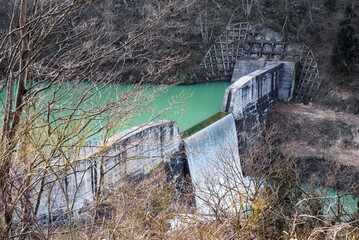 Small dam on a reservoir in the mountains of the Tohoku region of Japan.